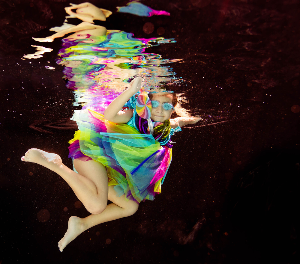 black backdrop, underwater picture, concept photo shoot, Candyland, legs, tulle skirt, rainbow