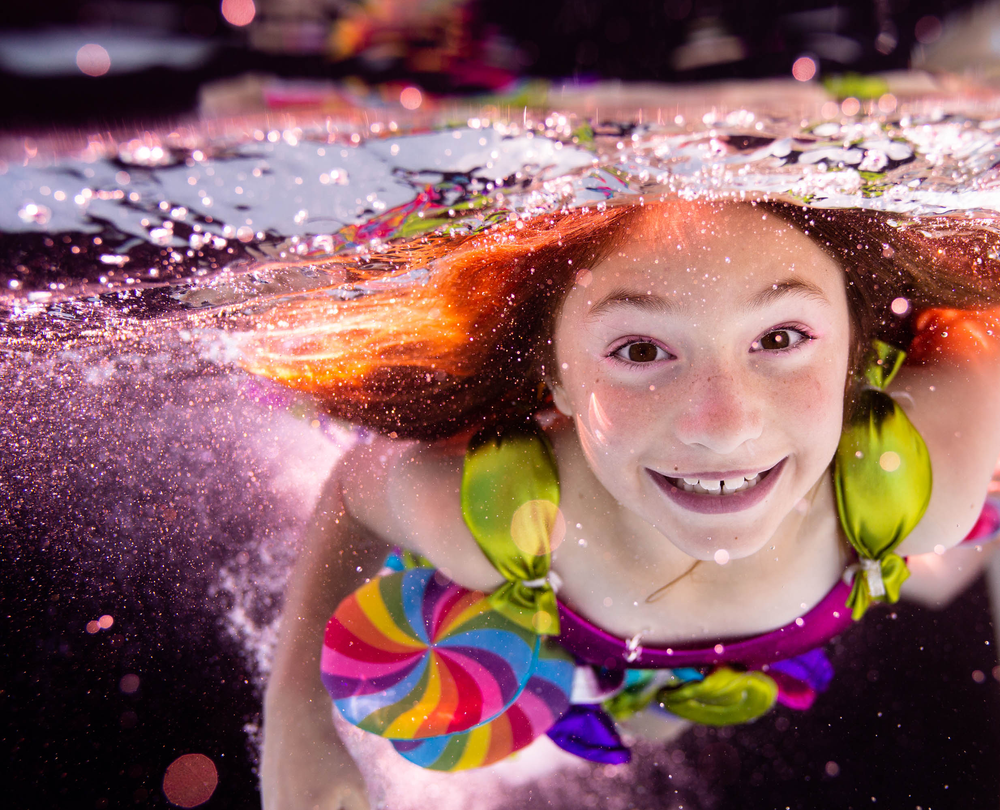 San Jose underwater photography, pool, blue pool, lollipop dress, girl, brown hair, brown eyes, concept photo shoot