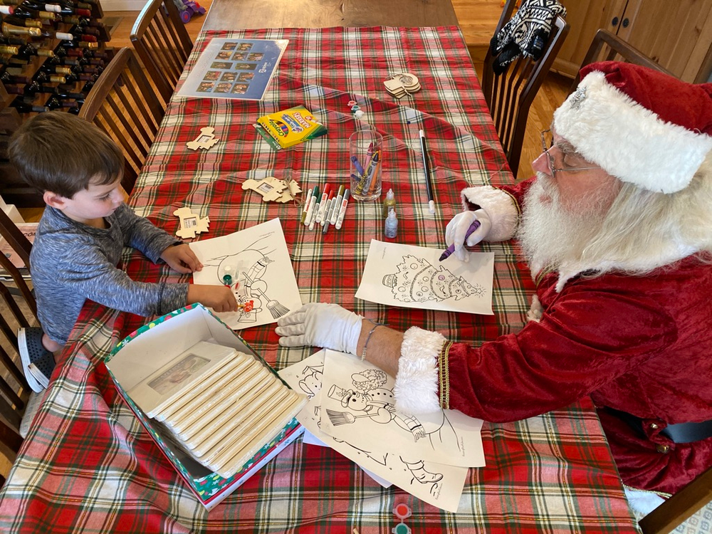 coloring with Santa, plaid tablecloth, boy, Santa, wine rack