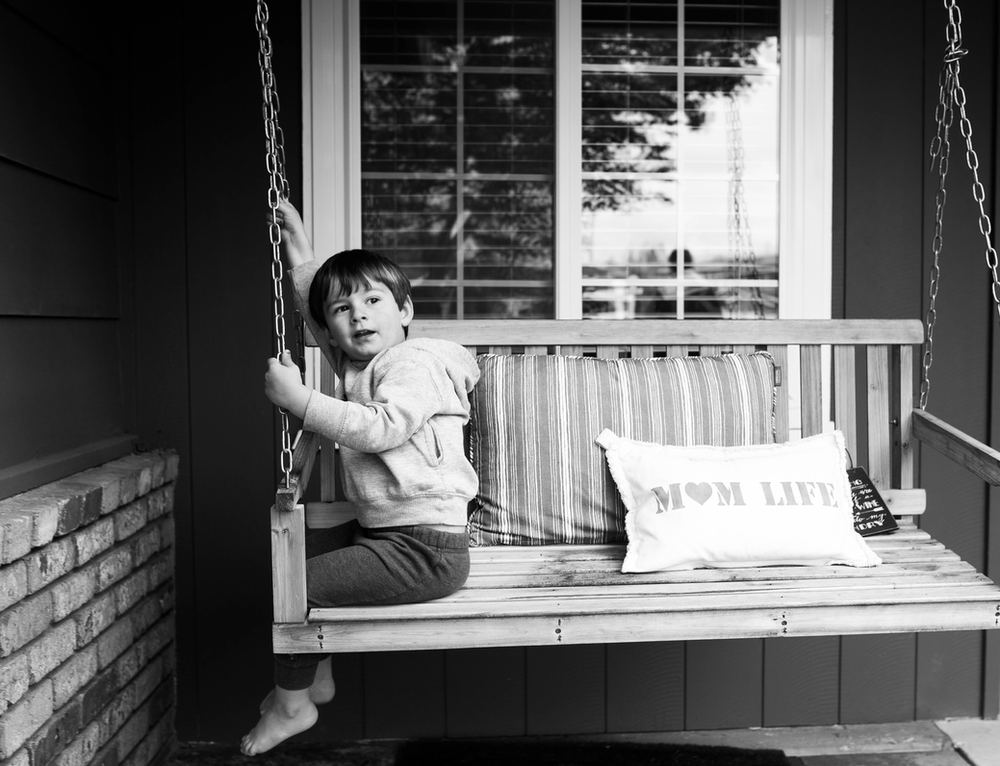 black and white portrait, porch swing