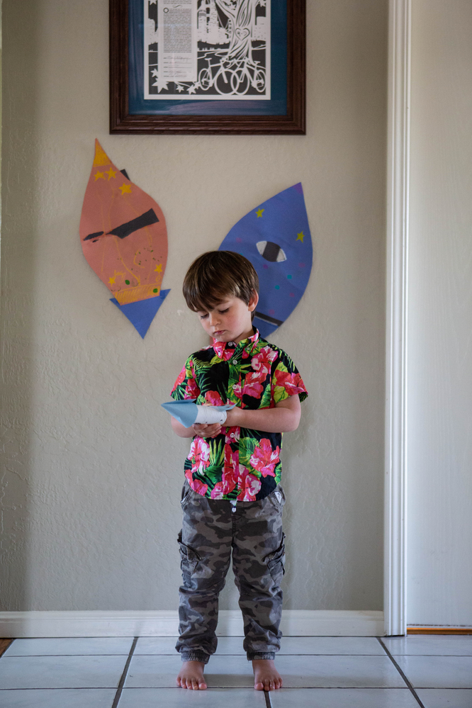 toddler boy, Hawaiian shirt, toilet paper roll spaceship